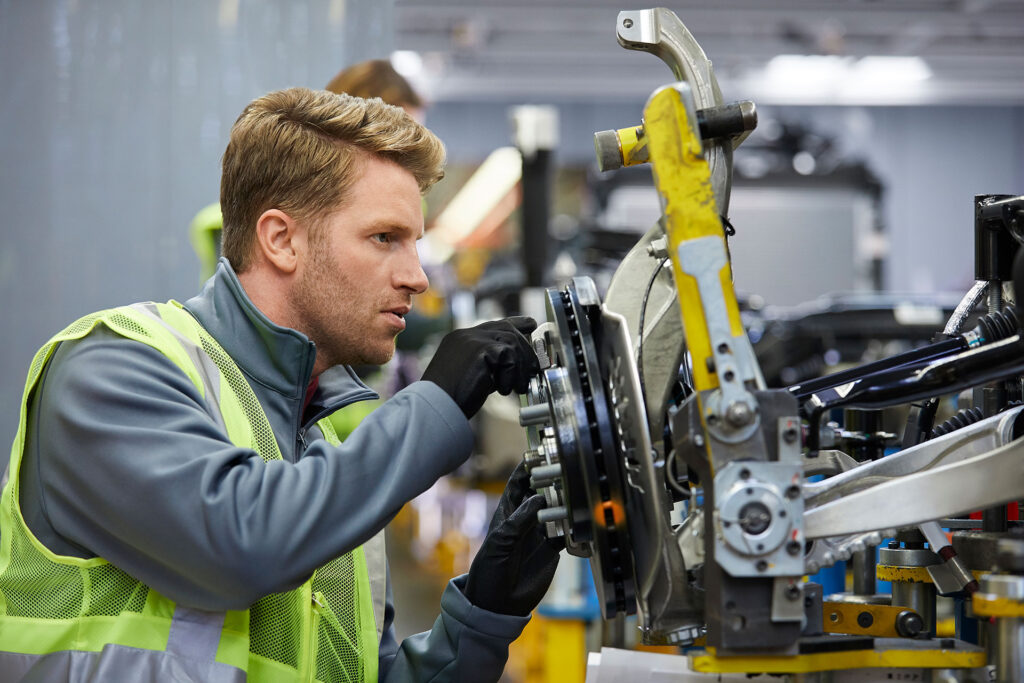 Factory worker using tools for machinist 